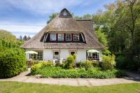 B&B Manhagen - Reetdachhaus mit Nähe zur Ostsee, Außensauna, Spielplatz & großem Garten - Bed and Breakfast Manhagen