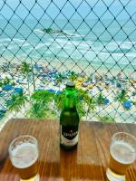 Apartamento frente mar Guarujá Pitangueiras pé na areia - B&B Guarujá