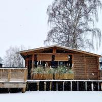 Rustig gelegen chalet Solvo met terras aan het water - B&B Geel