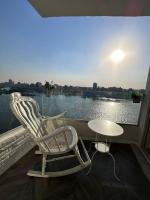 شقه فندقيه عائليه اطلاله على النيل بانوراما - B&B El Cairo