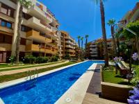Apartamento con piscina y playa cercana en Torrevieja, area de Punta Prima AQ-125 - Chambres d'hôtes Punta Prima