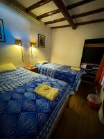 Tweepersoonskamer met 1 of 2 Bedden en Gedeelde Badkamer