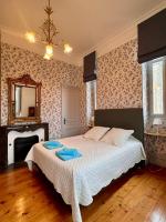 Zimmer mit Queensize-Bett und Gartenblick