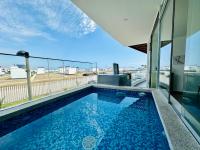 Moderno Departamento con Piscina y Parrilla, 3 min de la playa, Asia - Chambres d'hôtes Asia