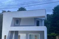 Casa nova bem localizada e confortável. - Chambres d’hôtes