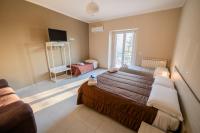 Deluxe Vierbettzimmer mit Balkon