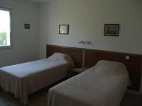 Apartment mit 2 Einzelbetten und Terrasse sowie Gartenblick