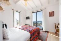 Kamer met Queensize Bed en Uitzicht op Zee