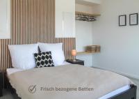 Buddha Apartment - stadtnah, Balkon, Parkplatz, E-Ladestation für Autos & Fahrräder, Fitnessstudio - Chambres d'hôtes Coblence