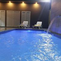 Recanto Matheus, Casa confortável com estacionamento, wi-fi e piscina aquecida - Olímpia SP - B&B Olímpia