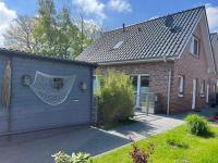 Haus Nordseeliebe mit Außensauna, Outdoor Dusche und Wallbox - Chambres d’hôtes Dornum