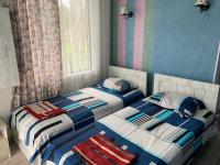 Tweepersoonskamer met 2 Aparte Bedden