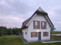 Reetland am Meer - Luxus Reetdachvilla mit 3 Schlafzimmern, Sauna und Kamin H07 - B&B Dranske