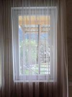 Tweepersoonskamer met 2 aparte bedden en Uitzicht op de Tuin