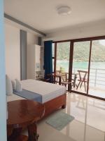 Habitación Doble Deluxe con balcón y vistas al mar