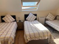 Dreibettzimmer mit Bergblick
