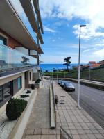 Un rincón con vistas a la Ría, playa y parking. - B&B