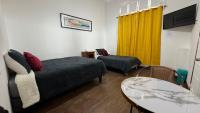 Habitación Triple Básica con baño compartido