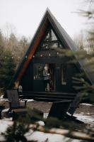Two Black Cabins - Bed and Breakfast Pabaži