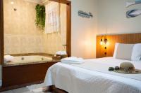 Zimmer mit Kingsize-Bett und Whirlpool