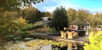 Wellness Tuin - Luxe Wellness Suite met Jacuzzi en Openhaard in Romantische stijl - B&B Horst