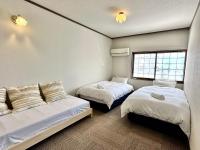 Chambre Lits Jumeaux avec Salle de Bains Commune