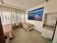 Camera Standard Doppia con Letti Singoli con Bagno in Comune