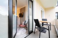 Das Solaris 4 Beach Apartment mit Balkon, Gemeinschaftssauna und Grillplatz - Chambres d’hôtes Grömitz