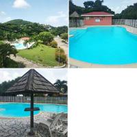 Appartement F2 en résidence avec piscine et plage à 5min à pied - Chambres d'hôtes Les Trois-Îlets