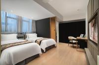 Camera Deluxe Doppia con Letti Singoli