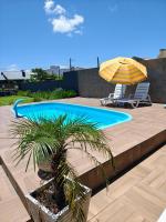 Casa ,piscina há 100 metros do mar ,24 pessoas - Chambres d’hôtes Capão da Canoa