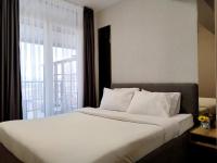 One-Bedroom Apartment with Balcony and City View