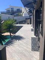 Penguins Cove Coastal Haven Studio Apartment-Bloubergstrand - B&B Città del Capo