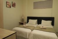 Tweepersoonskamer met 2 Aparte Bedden en Douche