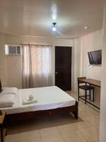 S and T Tourist Inn - Bed and Breakfast Bulalaqui
