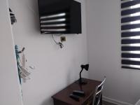 mini lolf una habitación con tres camas - B&B Iquique