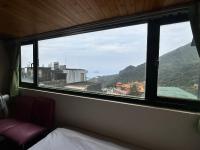 Habitación Familiar con vista lateral al mar