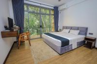 Chambre Double Deluxe (2 Adultes + 1 Enfant)