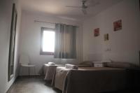 Camera Doppia con Letti Singoli e Bagno in Comune