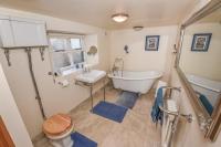 Last-Minute Escapes l Sleeps Up to 4 l A delightful thatched cottage with all the modern facilities you will require l There are 2 bedrooms, one with a double bed l the other with two singles l Carrick Thatched Cottage l WeStayBelfast - B&B Eden