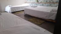 Dreibettzimmer mit Gartenblick