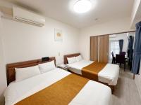 Deluxe Room with Kitchen (2 Double Beds and 1 Sofa Bed) - Non-Smoking