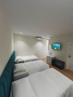 Camera Tripla con Vista Giardino