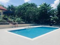 The poolhouse at McKirdy's mango farm - Bed and Breakfast Sison