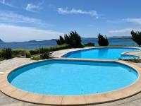 Luxury apartment Elicriso sea view with common swimming pool just 100 mt from the beach - Chambres d'hôtes Golfo Aranci