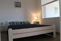 One-Bedroom Apartment with Balcony and Sea/Town View