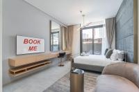 A Premium and Modern Studio in The Autograph JVC - Chambres d’hôtes Dubaï