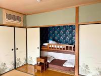 Camera Familiare con Bagno in Comune