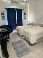 Deluxe Tweepersoonskamer met 1 of 2 Bedden en Uitzicht op de Tuin