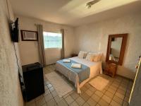 Kamer met Queensize Bed en Uitzicht op Zee